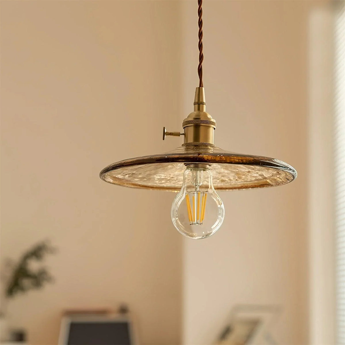 Sleek Mid Century Glass Pendant Light with Brass Shade