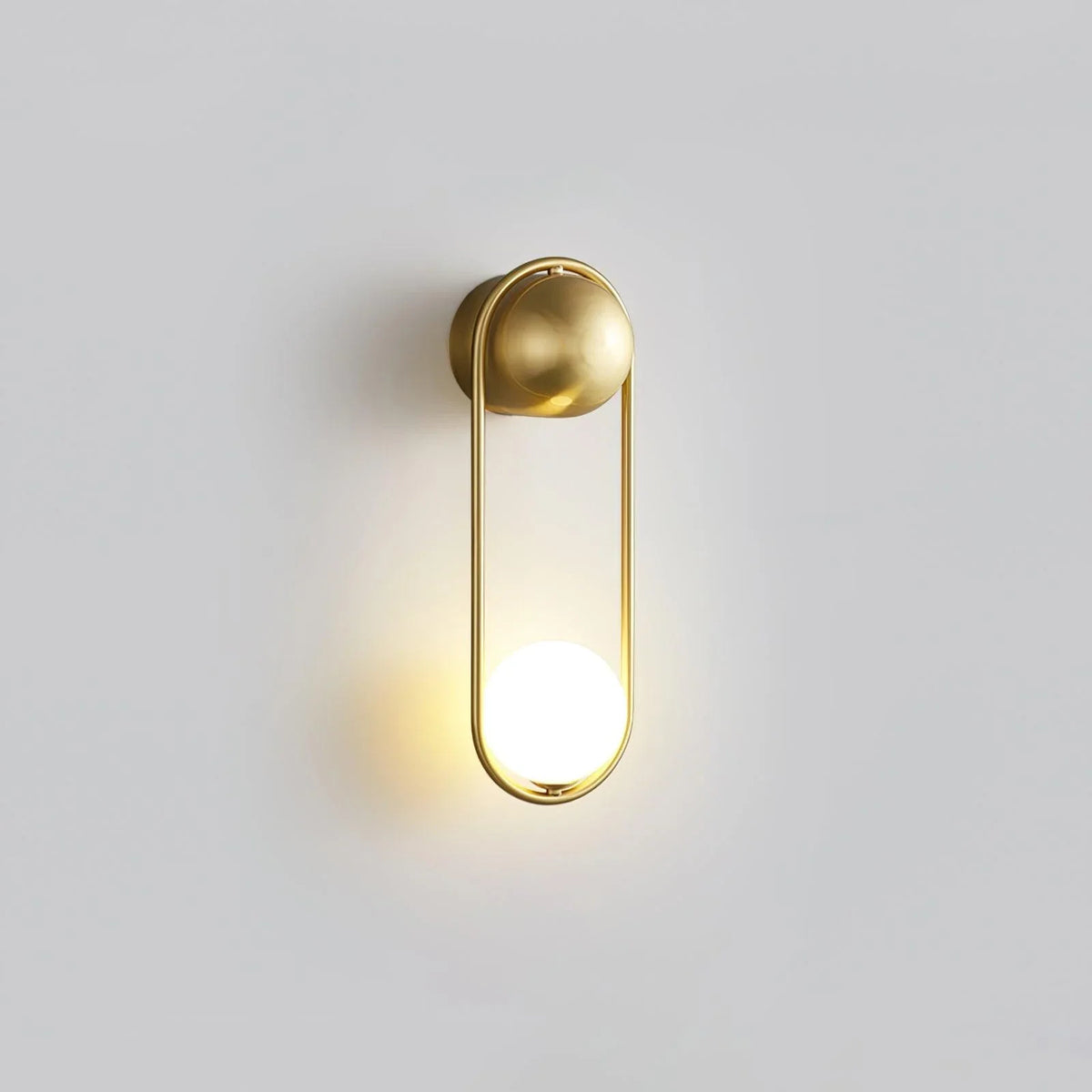 Sleek Brass Wall Sconce with Glass Shade