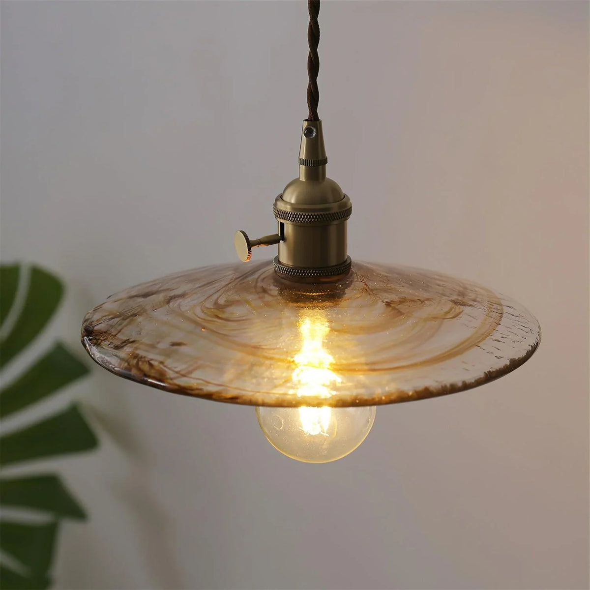 Sleek Mid Century Glass Pendant Light with Brass Shade