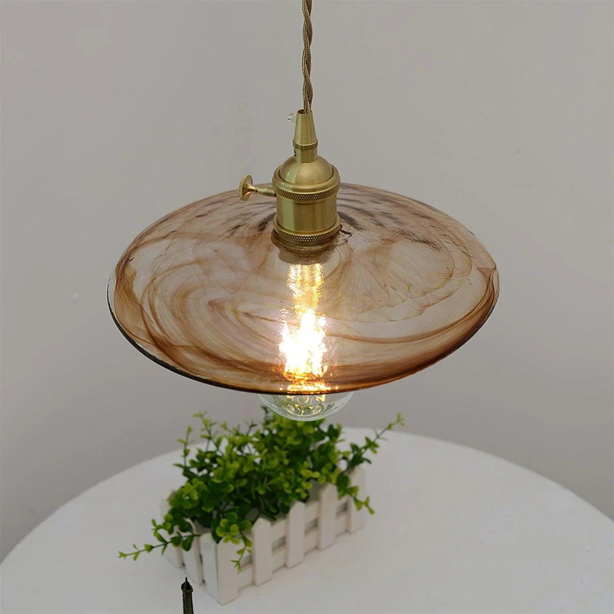 Sleek Mid Century Glass Pendant Light with Brass Shade